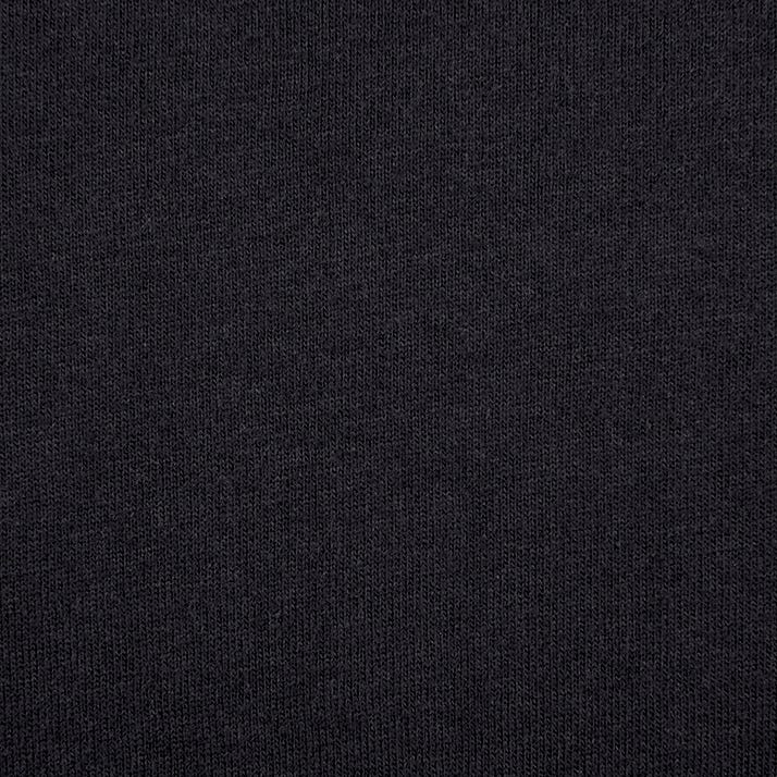 A close up of the black fabric that is used to make the t-shirt
