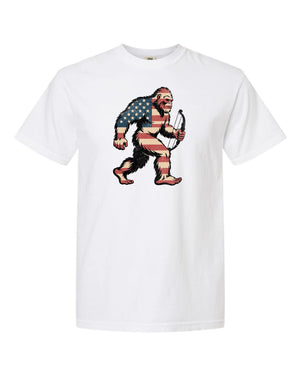 American Bigfoot hunting t-shirt with USA flag overlay design, Bigfoot carrying bow graphic on white tee for hunters and cryptid fans